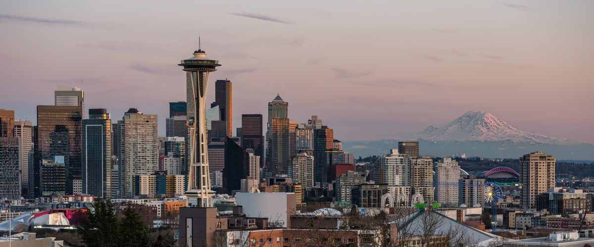 Downtown Seattle, the Space Needle and Mount Rainier at dusk